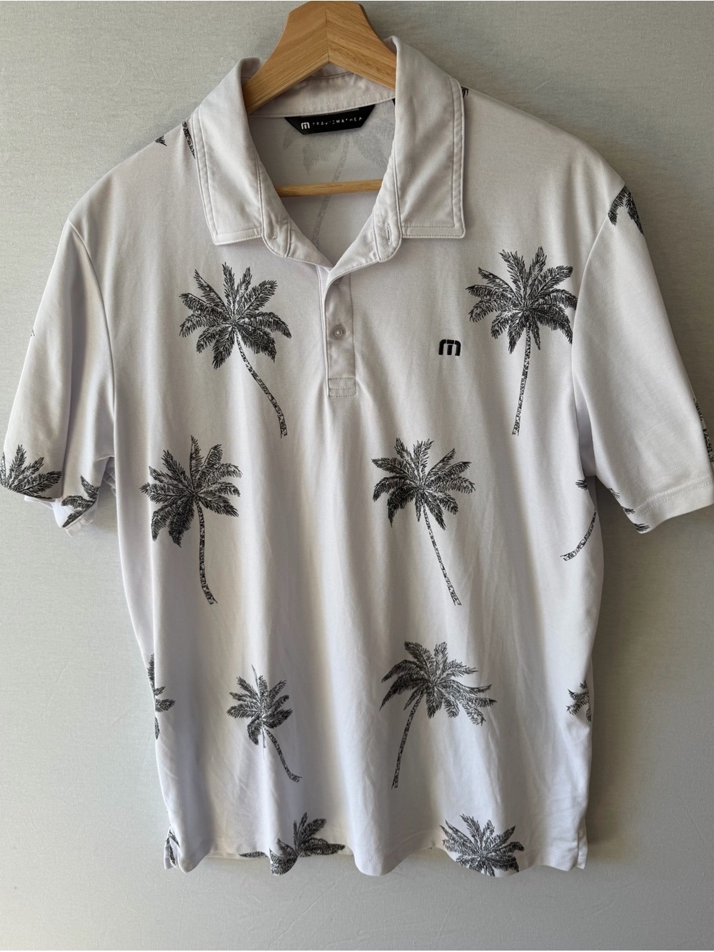 Travis Mathew White Polo with Black Palm Print